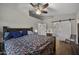 Spacious bedroom boasts wood floors, barn door access, and natural light at 1422 E Royal Palm Rd, Phoenix, AZ 85020