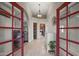Warm and inviting foyer featuring tiled floors, an arched ceiling, and views of the living spaces at 1422 E Royal Palm Rd, Phoenix, AZ 85020