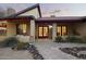 Inviting front entrance featuring a decorative walkway, red framed windows, and desert landscaping at 1422 E Royal Palm Rd, Phoenix, AZ 85020