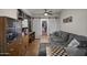 Comfortable sitting area with a gray couch and sliding barn doors at 1422 E Royal Palm Rd, Phoenix, AZ 85020