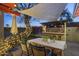 Inviting outdoor dining area with a barbecue grill and lush greenery, perfect for entertaining friends and Gathering at 1422 E Royal Palm Rd, Phoenix, AZ 85020