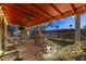 Cozy covered patio with seating, ambient lighting, and charming landscaping, perfect for outdoor entertaining at 1422 E Royal Palm Rd, Phoenix, AZ 85020