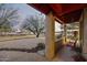 Charming covered porch with a swing and views of the landscaped front yard at 1422 E Royal Palm Rd, Phoenix, AZ 85020