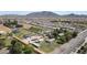 Aerial of large property with horse facilities, homes, and mountain views at 15218 E San Tan Blvd, Gilbert, AZ 85298