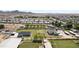 Aerial view of large property with horse facilities, homes, and manicured landscaping at 15218 E San Tan Blvd, Gilbert, AZ 85298
