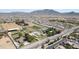 Aerial view of community with horse facilities, homes, and desert landscaping at 15218 E San Tan Blvd, Gilbert, AZ 85298