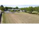 Acreage lot with mature trees surrounding a charming single-story home with large driveway and fenced yard at 15218 E San Tan Blvd, Gilbert, AZ 85298