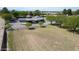 Aerial view of a spacious, grassy yard, fenced-in, with mature trees and a charming single-story home at 15218 E San Tan Blvd, Gilbert, AZ 85298