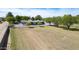 Expansive grassy yard, fenced-in, with mature trees and a well-maintained single-story home at 15218 E San Tan Blvd, Gilbert, AZ 85298