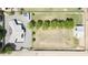 Aerial view of a large property with a main house, guest house, large lawn, mature trees, and ample parking at 15218 E San Tan Blvd, Gilbert, AZ 85298
