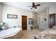 Bright bathroom boasts tub, granite counters, wood accents, and modern glass shower at 15218 E San Tan Blvd, Gilbert, AZ 85298