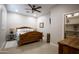 Comfortable bedroom with wooden furniture, decorative accents, and warm lighting at 15218 E San Tan Blvd, Gilbert, AZ 85298