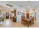 Inviting dining area with wooden table and chairs, seamlessly connecting to kitchen and entryway at 15218 E San Tan Blvd, Gilbert, AZ 85298