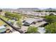 Aerial view showcasing the home's architecture and neighborhood with surrounding trees and mountains at 15218 E San Tan Blvd, Gilbert, AZ 85298