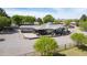 Aerial view capturing the home's exterior, surrounding greenery, and paved driveway at 15218 E San Tan Blvd, Gilbert, AZ 85298