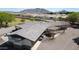 Aerial view showcasing the home's roof, neighborhood, and distant mountains at 15218 E San Tan Blvd, Gilbert, AZ 85298