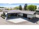 Aerial view of a home exterior, showing a spacious driveway, garage, and stone accents at 15218 E San Tan Blvd, Gilbert, AZ 85298