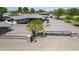 Aerial view of the property, featuring a gated entrance and well-maintained landscaping at 15218 E San Tan Blvd, Gilbert, AZ 85298