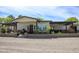 Charming single-story home with a gravel front yard, covered porch, stone accents, and manicured landscaping at 15218 E San Tan Blvd, Gilbert, AZ 85298