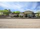 Spacious single-story home with a gravel front yard, covered porch, and desert landscaping for great curb appeal at 15218 E San Tan Blvd, Gilbert, AZ 85298