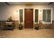 Inviting front porch with stylish door, stone accents, planters, and a welcoming atmosphere at 15218 E San Tan Blvd, Gilbert, AZ 85298