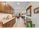 Spacious hallway offering seamless transition between living spaces with tiled floors and neutral walls at 15218 E San Tan Blvd, Gilbert, AZ 85298