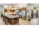 Bright kitchen features a large island, stainless steel appliances, custom wood cabinets and adjacent to an outdoor patio at 15218 E San Tan Blvd, Gilbert, AZ 85298