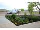 Landscaping with colorful plants complement this spacious property, offering a serene outdoor environment at 15218 E San Tan Blvd, Gilbert, AZ 85298