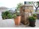 Landscaping details with potted plants and stone accents enhance this property's curb appeal at 15218 E San Tan Blvd, Gilbert, AZ 85298
