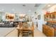 Open-concept living space featuring a comfortable leather sofa and seamless flow to kitchen at 15218 E San Tan Blvd, Gilbert, AZ 85298