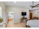Inviting main bedroom suite with en-suite bath, television, and rustic decor at 15218 E San Tan Blvd, Gilbert, AZ 85298