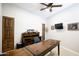 Office space showcasing a large wood desk, custom built-ins, and ample room for work or study at 15218 E San Tan Blvd, Gilbert, AZ 85298