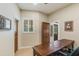 Office space showcasing a large wood desk and two doors at 15218 E San Tan Blvd, Gilbert, AZ 85298