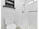 Bathroom features a white shower with glass doors and a toilet with neutral flooring at 1684 Leisure World --, Mesa, AZ 85206