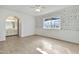 Bedroom with neutral flooring, bathroom access, and a sunny window at 1684 Leisure World --, Mesa, AZ 85206