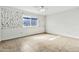 Spacious bedroom featuring tile floors, a ceiling fan, and large window at 1684 Leisure World --, Mesa, AZ 85206
