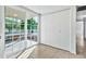 Bright bedroom with large closet, tile flooring, and sliding glass door to the backyard at 1684 Leisure World --, Mesa, AZ 85206