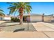 Charming single-story home featuring a landscaped front yard, brick accents, and a two-car garage at 1684 Leisure World --, Mesa, AZ 85206