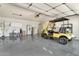 Spacious garage with a sink, cabinets, and a golf cart at 1684 Leisure World --, Mesa, AZ 85206