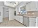 Bright eat-in kitchen with white cabinetry, stainless steel appliances and a ceiling fan at 1684 Leisure World --, Mesa, AZ 85206