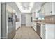 Bright eat-in kitchen with a ceiling fan, white cabinetry and stainless steel appliances at 1684 Leisure World --, Mesa, AZ 85206