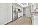 Bright eat-in kitchen with a ceiling fan, white cabinetry, and stainless steel refrigerator at 1684 Leisure World --, Mesa, AZ 85206