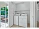 Laundry room featuring a washer, dryer and shelving at 1684 Leisure World --, Mesa, AZ 85206