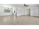 Spacious living room with tile flooring, neutral walls, and a ceiling fan for added comfort at 1684 Leisure World --, Mesa, AZ 85206