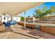 Spacious covered patio, showcasing an outdoor seating area and views of the enclosed backyard at 1684 Leisure World --, Mesa, AZ 85206