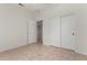 Bedroom with closet space and tiled flooring at 16902 W Marcos De Niza Dr, Surprise, AZ 85387
