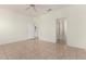 Spacious bedroom with tile flooring and ceiling fan at 16902 W Marcos De Niza Dr, Surprise, AZ 85387