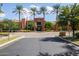 Exterior of the community clubhouse with palm trees, showcasing amenities and manicured landscape at 16902 W Marcos De Niza Dr, Surprise, AZ 85387
