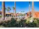 Beautiful community pool area with ample seating, landscaping, and shade for relaxation at 16902 W Marcos De Niza Dr, Surprise, AZ 85387