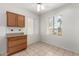 Charming dining area featuring built-in cabinetry and a sunlit window with a view of the outdoors at 16902 W Marcos De Niza Dr, Surprise, AZ 85387